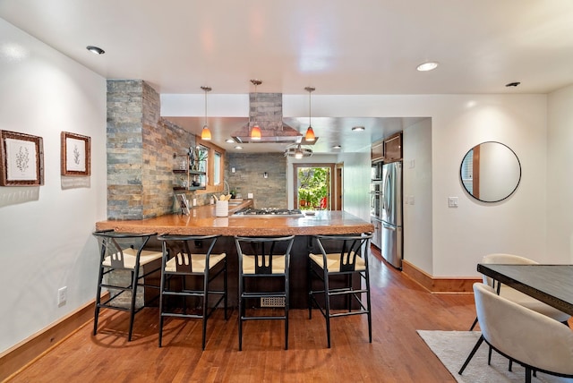 1420 W Main Ave, Spokane, WA 99201 - dining area featuring wood finished floors and baseboards