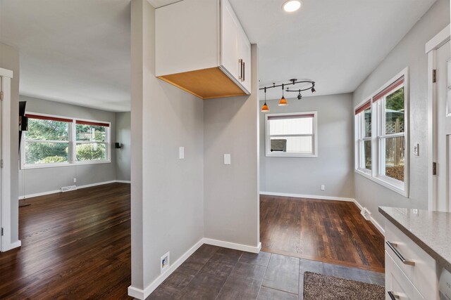 3218 E 24th Ave, Spokane, WA 99223 - kitchen with white cabinets, dark wood-style floors, and light stone counters