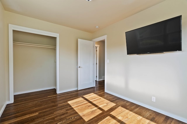 3218 E 24th Ave, Spokane, WA 99223 - unfurnished bedroom featuring wood finished floors and a closet