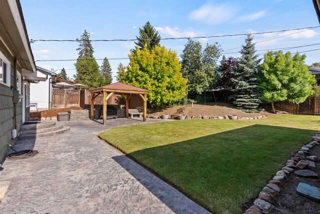 3218 E 24th Ave, Spokane, WA 99223 - fenced backyard with a gazebo and a patio