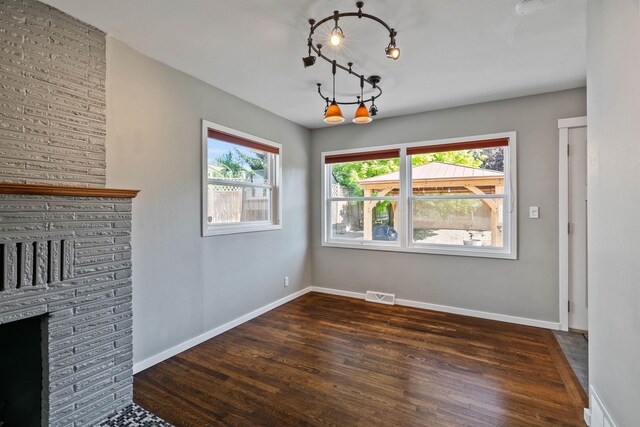 3218 E 24th Ave, Spokane, WA 99223 - unfurnished dining area with a chandelier and wood finished floors