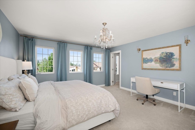 4620 E 43rd Ave, Spokane, WA 99223 - bedroom with a chandelier, multiple windows, and light carpet