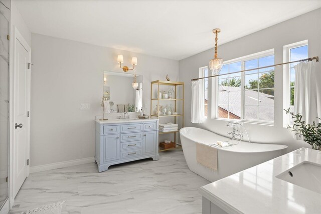 4620 E 43rd Ave, Spokane, WA 99223 - bathroom with vanity, a chandelier, marble look tile flooring, and a freestanding bath