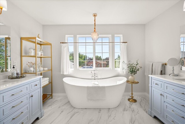4620 E 43rd Ave, Spokane, WA 99223 - full bathroom featuring marble look tile flooring, vanity, and a soaking tub