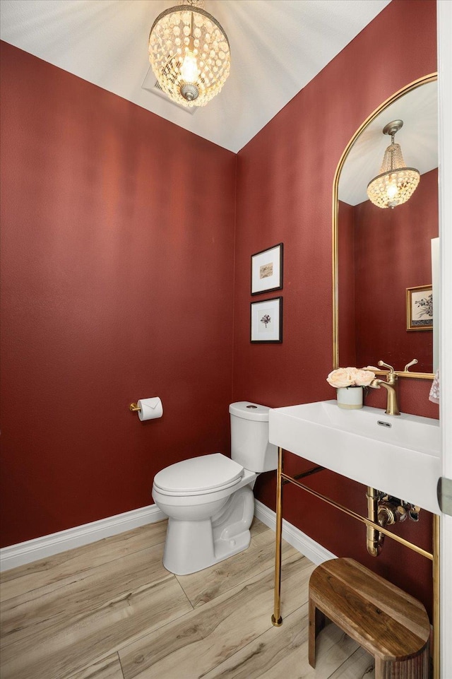 4620 E 43rd Ave, Spokane, WA 99223 - half bathroom featuring wood finished floors and vanity