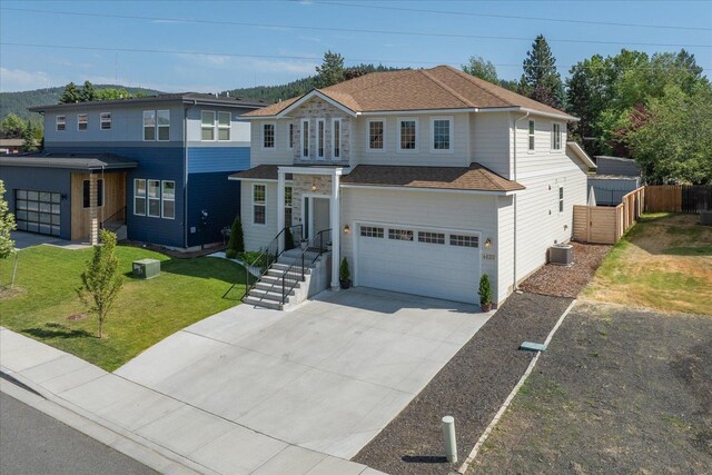 4620 E 43rd Ave, Spokane, WA 99223 - view of front facade featuring an attached garage, driveway, and roof with shingles