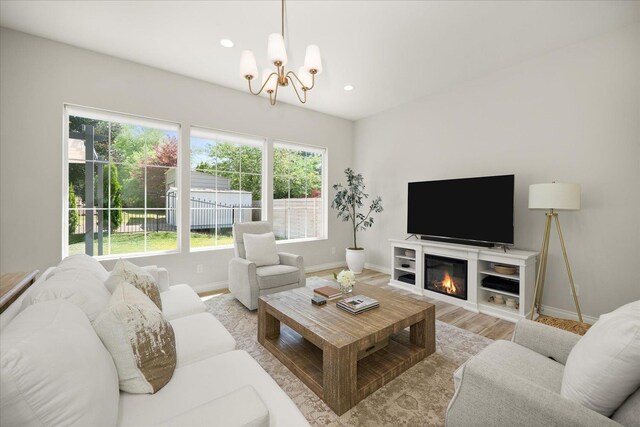 4620 E 43rd Ave, Spokane, WA 99223 - living area featuring a chandelier, plenty of natural light, wood finished floors, recessed lighting, and a glass covered fireplace