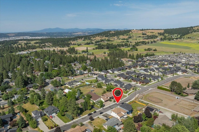 4620 E 43rd Ave, Spokane, WA 99223 - aerial view of property and surrounding area with a mountainous background and nearby suburban area