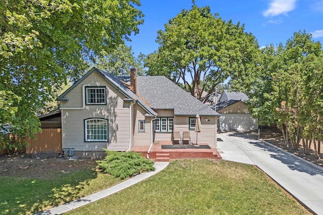 4217 E 22nd Ave, Spokane, WA 99223 - view of front facade featuring a chimney and a shingled roof