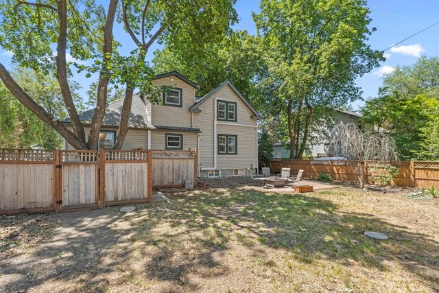 4217 E 22nd Ave, Spokane, WA 99223 - rear view of house featuring a fenced backyard and a patio