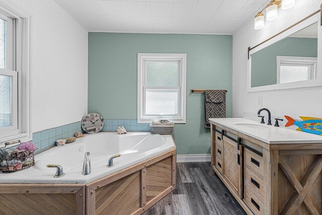 4217 E 22nd Ave, Spokane, WA 99223 - full bath with vanity, wood finished floors, and a garden tub