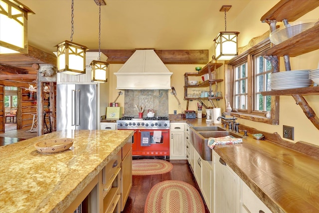 4629 Mix Way, Loon Lake, WA 99148 - kitchen with high quality appliances, premium range hood, dark wood-style floors, and healthy amount of natural light