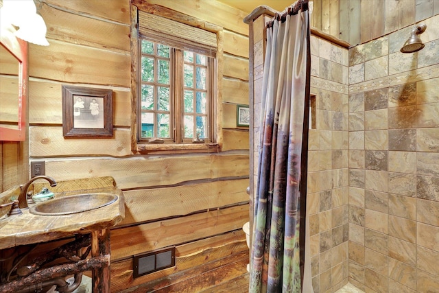 4629 Mix Way, Loon Lake, WA 99148 - bathroom with tiled shower, wooden walls, and vanity