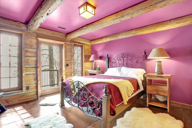 4629 Mix Way, Loon Lake, WA 99148 - bedroom with beamed ceiling, access to exterior, and wood finished floors