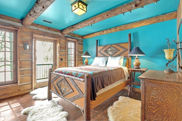 4629 Mix Way, Loon Lake, WA 99148 - bedroom featuring access to outside, wood-type flooring, beamed ceiling, multiple windows, and wood walls