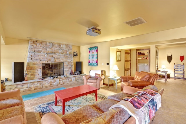 4629 Mix Way, Loon Lake, WA 99148 - carpeted living room with washing machine and clothes dryer and a fireplace