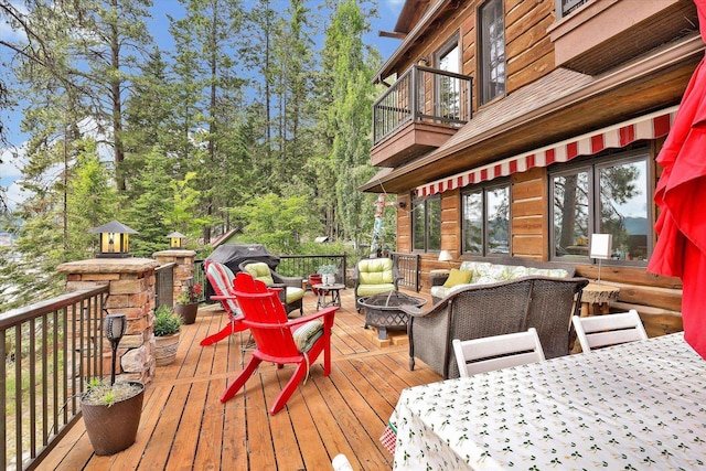 4629 Mix Way, Loon Lake, WA 99148 - wooden deck featuring an outdoor living space with a fire pit and area for grilling