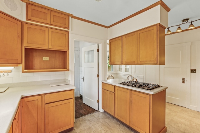 1107 W 19th Ave, Spokane, WA 99203 - kitchen featuring stainless steel gas cooktop, light countertops, ornamental molding, backsplash, and brown cabinets