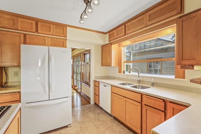 1107 W 19th Ave, Spokane, WA 99203 - kitchen with white appliances, plenty of natural light, light countertops, and brown cabinets