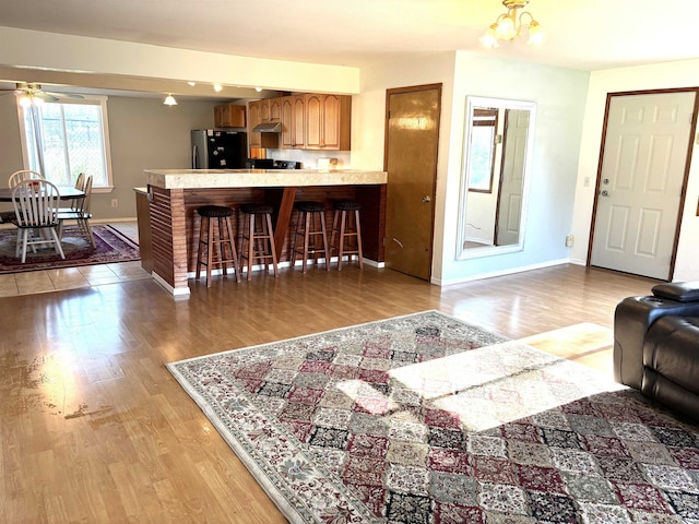 8602 E E Harrington Ave, Spokane Valley, WA 99212 - living area with light wood-style flooring and ceiling fan