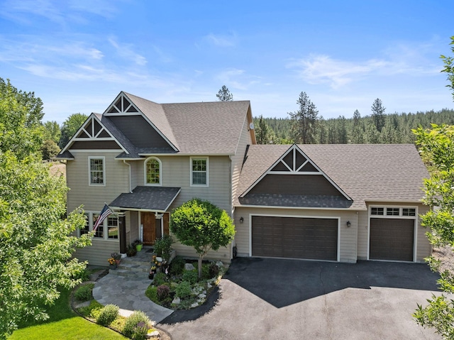 5857 Little Sandy Loop Rd, Nine Mile Falls, WA 99026 - craftsman-style home with an attached garage, driveway, and a shingled roof