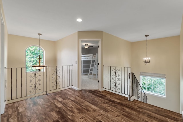 5857 Little Sandy Loop Rd, Nine Mile Falls, WA 99026 - spare room featuring dark wood-style floors, plenty of natural light, a chandelier, and recessed lighting