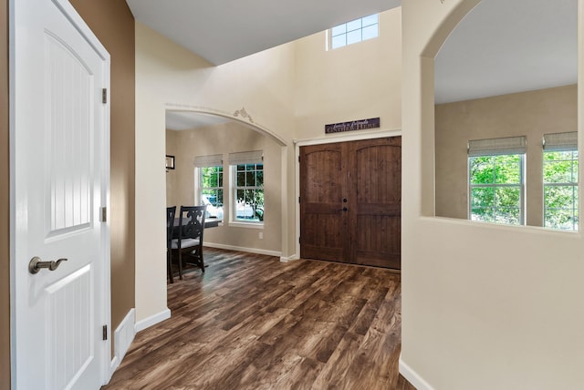 5857 Little Sandy Loop Rd, Nine Mile Falls, WA 99026 - entryway featuring arched walkways, healthy amount of natural light, and dark wood finished floors