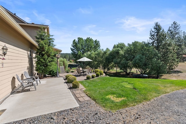 5857 Little Sandy Loop Rd, Nine Mile Falls, WA 99026 - view of grassy yard featuring a patio area