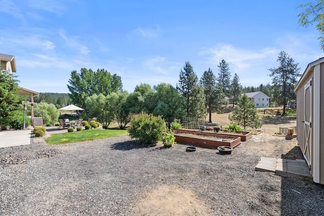 5857 Little Sandy Loop Rd, Nine Mile Falls, WA 99026 - view of yard featuring a vegetable garden