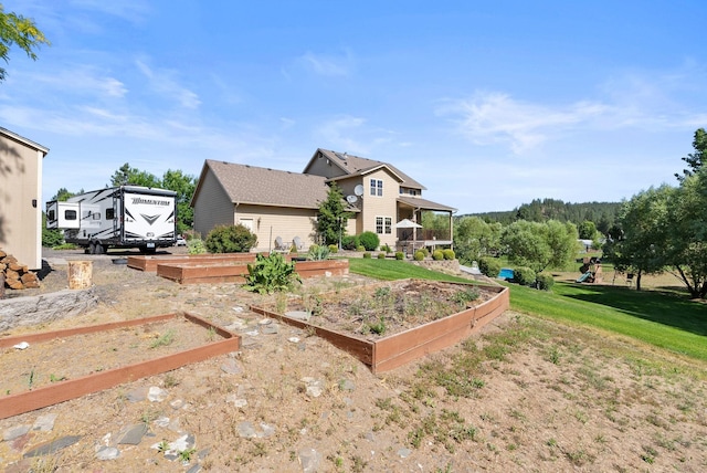 5857 Little Sandy Loop Rd, Nine Mile Falls, WA 99026 - rear view of property with a garden, a yard, and a playground