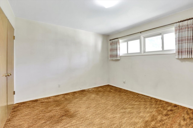 1718 E 39th Ave, Spokane, WA 99203 - carpeted empty room with baseboards