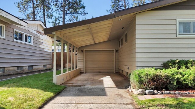1718 E 39th Ave, Spokane, WA 99203 - view of vehicle parking with driveway, an attached garage, and a carport