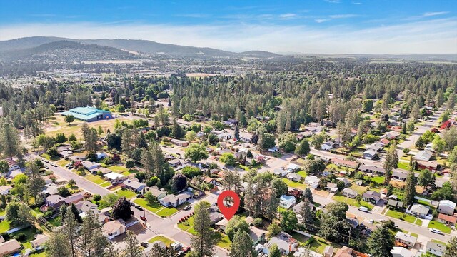 1718 E 39th Ave, Spokane, WA 99203 - view of property location with a mountain backdrop and a heavily wooded area