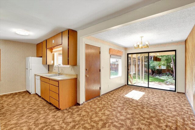 1718 E 39th Ave, Spokane, WA 99203 - kitchen with a chandelier, light carpet, light countertops, and plenty of natural light