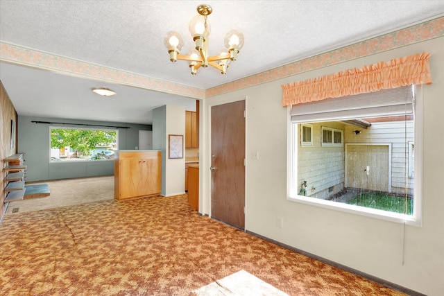 1718 E 39th Ave, Spokane, WA 99203 - hall featuring carpet floors and a chandelier
