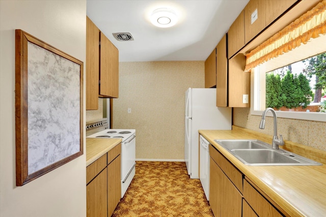 1718 E 39th Ave, Spokane, WA 99203 - kitchen with white appliances, light countertops, tasteful backsplash, and light flooring