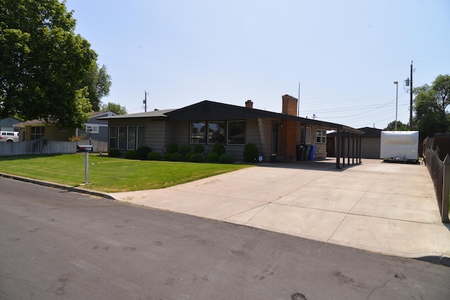 7516 E Baldwin Ave, Spokane Valley, WA 99212 - ranch-style house featuring a chimney and concrete driveway