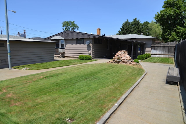 7516 E Baldwin Ave, Spokane Valley, WA 99212 - back of property featuring a chimney