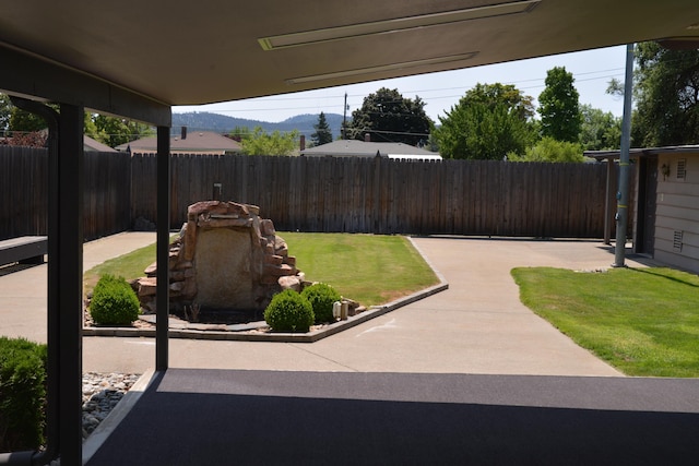 7516 E Baldwin Ave, Spokane Valley, WA 99212 - fenced backyard with a patio area and a mountain view