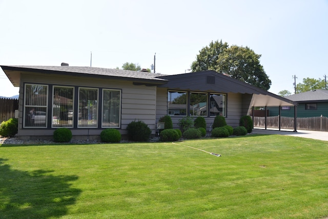 7516 E Baldwin Ave, Spokane Valley, WA 99212 - rear view of property with an attached carport
