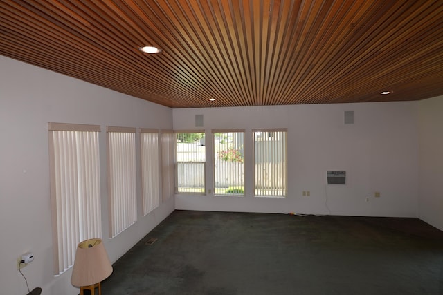 7516 E Baldwin Ave, Spokane Valley, WA 99212 - empty room with dark carpet, wood ceiling, a wall unit AC, and recessed lighting