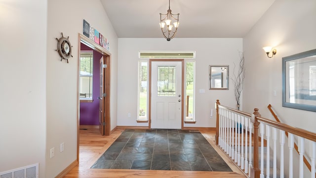 19918 E Pheasant Dr, Greenacres, WA 99016 - foyer featuring a chandelier and stone finish floors