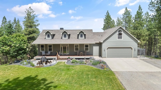 19918 E Pheasant Dr, Greenacres, WA 99016 - cape cod house with a porch, a front yard, driveway, a garage, and roof with shingles
