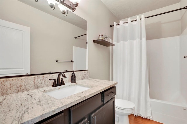 2204 S Lloyd Ct, Spokane, WA 99223 - bathroom featuring vanity, shower / bath combination with curtain, and wood finished floors
