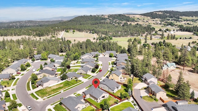 2204 S Lloyd Ct, Spokane, WA 99223 - aerial view of property and surrounding area featuring mountains and nearby suburban area