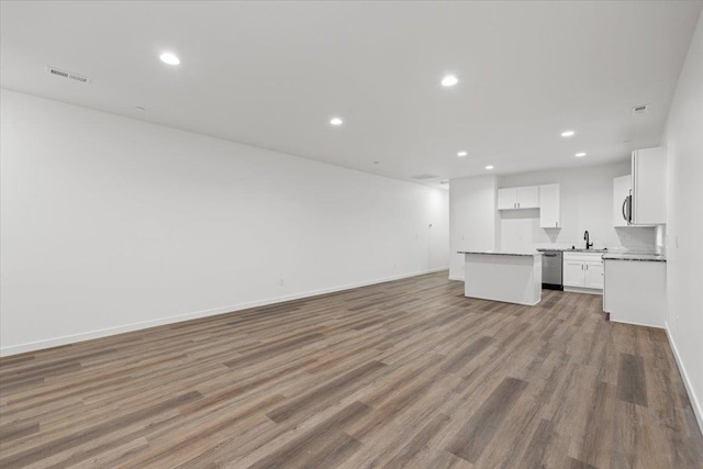 2236 E 4th Ave, Spokane, WA 99202 - unfurnished living room featuring recessed lighting and wood finished floors