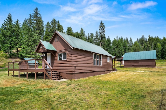 1541 Thompson Rd, Elk, WA 99009 - view of property exterior with a metal roof, a lawn, a deck, and stairway