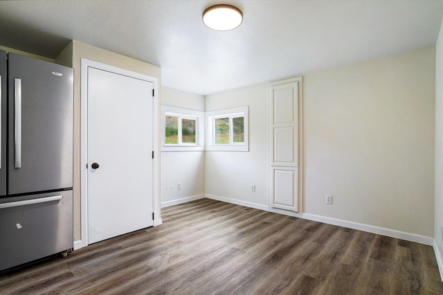 1541 Thompson Rd, Elk, WA 99009 - unfurnished bedroom featuring freestanding refrigerator and wood finished floors