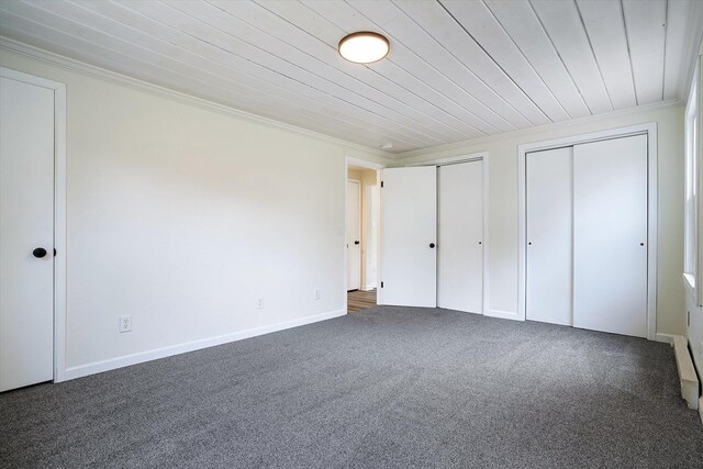 1541 Thompson Rd, Elk, WA 99009 - unfurnished bedroom with crown molding, two closets, carpet floors, and wood ceiling