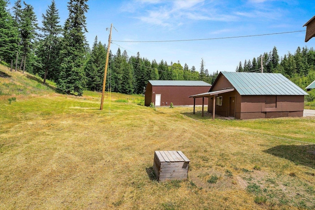 1541 Thompson Rd, Elk, WA 99009 - view of grassy yard featuring a pole building and an outbuilding